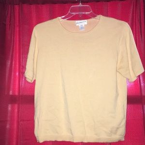 Light yellow sweater.